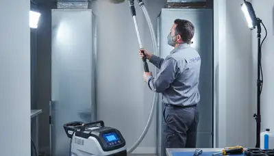 Technician cleaning air ducts for AC system in Fort Worth, TX home to improve HVAC efficiency